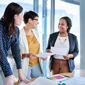 Explaining Prints: Group, paperwork and smile in office