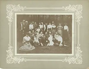 Group portrait of unknown young men and women in a forest