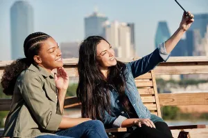 Using Phone Prints: Group of young co-workers hanging out on rooftop patio