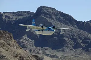 Aviation Prints: Grumman HU-16 Albatross, twin radial engine amphibious flying boat flying around and landing on Lake Mead