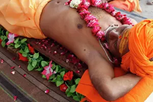 Facial Prints: Guru lying on a bed of nails in Pilot Baba camp at Kumbh Mela in Haridwar