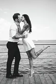 Freude Prints: Guy and girl on the sea pier Guy and girl on the sea pier posing on the camera