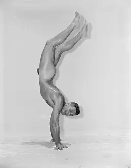 Gymnast Prints: gymnast on two hands shows upper body strength c.1956