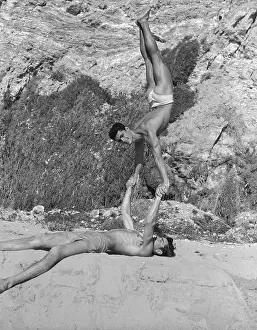 Bodybuilder Prints: Two Gymnastic Males Playing on the Beach c.1948