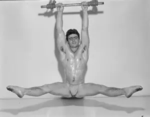 Attractive Prints: Gymnastic Youth Hanging from Overhead Bar c.1965