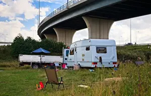 Caravan Prints: Gypsy caravan and truck on grassland under the flyover, Yorkshire, England