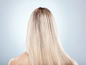 Mockup Prints: Hair, beauty and keratin with a model woman in studio on a gray background to promote a haircare product