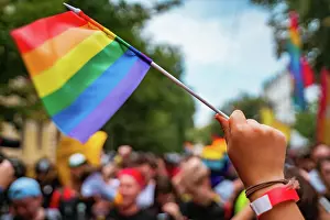 Hand hold a gay lgbt flag at LGBT gay pride parade festival LGBT pride