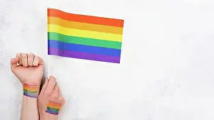 Assorted Prints: Hand with rainbow flag paint
