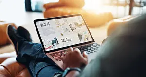 Decision Prints: Hands, laptop screen and person on sofa with reading website for marketing