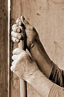 Rooms Prints: Hands marked by hard work supported on a pitchfork