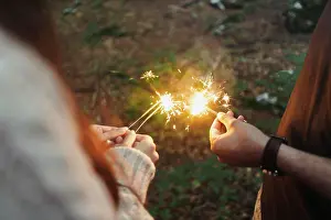Celebrate Prints: Hands with sparklers in woods