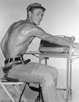 Jeans Prints: Handsome Shirtless Male in Jeans at Typewriter c.1962