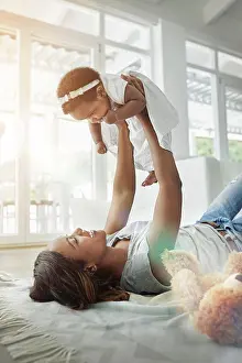 Teddy Bear Prints: Happy black woman, baby and playing on floor with love