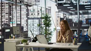 Financial Prints: Happy businesswoman celebrating a major project milestone