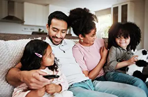 Video Prints: Happy family, parents and kids watching tv in home of movies