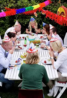 Midadult Men Prints: Happy friends celebrating crayfish party in lawn