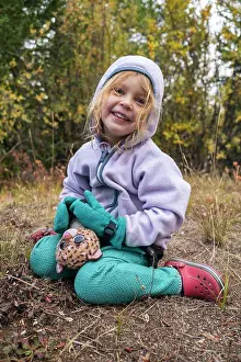 Red Hair Prints: Happy girl with toy in the wilderness, Colorado