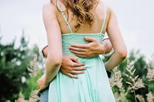Brown Prints: happy guy in a white shirt and a girl in a turquoise dress