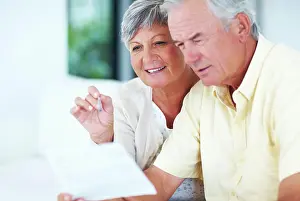 Bill Prints: Happy, mature couple and reading with bills for finance