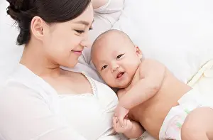 Asian And Indian Ethnicities Prints: Happy mother and child