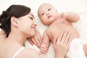 Asian And Indian Ethnicities Prints: Happy mother and child