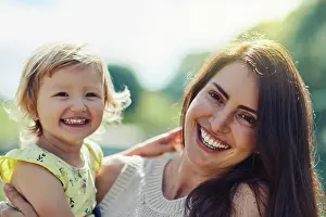 Happy mother, portrait and hug with daughter for bonding