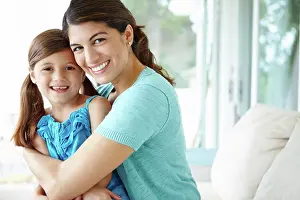 Relaxed Prints: Happy mother, portrait and hug with daughter on sofa for bonding