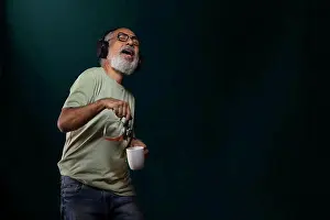 Smart Prints: A HAPPY OLD MAN SPILLING COFFEE WHILE DANCING TO MUSIC