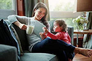 Happy Woman Prints: Happy woman, baby or mother in home with coffee to relax