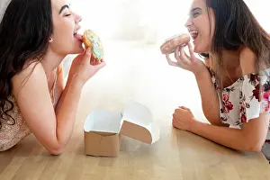 Cafe Prints: Happy women in sundresses with box of glazed desserts while sitting at table