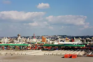 Urban Scene Prints: Harbor with a city in the background, Naha, Okinawa Island, Japan