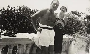 : Harold Marsh Harwood and Fryniwyd Tennyson (Jesse) Harwood standing against cement railing