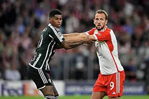 Sports Facility Prints: Harry Kane FC Bayern Munich FCB (09) tussles with Marcus Rashford Manchester United ManU (10) Champions League
