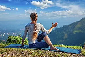 Mountain Chain Prints: Hatha yoga outdoors, woman doing yoga asana Parivrtta Marichyasana or ardha matsyendrasana