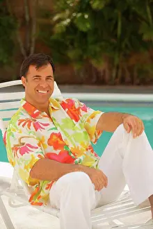 Residential Prints: Hawaii, Local man sitting in lawn chair by the pool