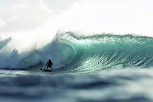 Curl Prints: Hawaii, Oahu, North Shore, Silhouette of a surfer inside the barrel of a large wave