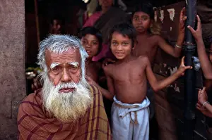 Elderly Prints: Head and shoulders portrait of an old Bangladeshi Bengali man with a white beard