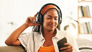 Audio Prints: Headphones, happy woman and relax with mobile on sofa with podcast