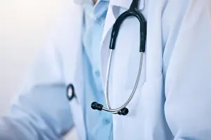 Healthcare, closeup and person with stethoscope for cardiology