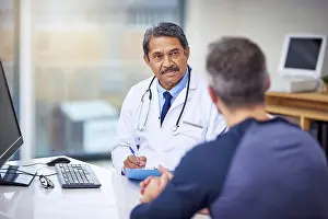 Consult Prints: Healthcare, consultation and male doctor talking to a patient about a diagnosis in the clinic