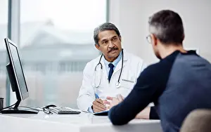 Physician Prints: Healthcare, office and doctor in a consultation with a patient in discussion on a diagnosis in the clinic