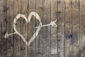 Valentines Prints: Heart shape with arrow symbol on wooden fence
