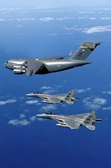 Aviation Prints: Hickam Air Force Base, Hawaii - F-15B Eagles escort the first Hawaii-based C-17 Globemaster III to its home