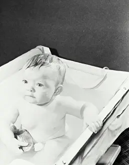 Cleaning Prints: High angle view of a baby in a bathtub