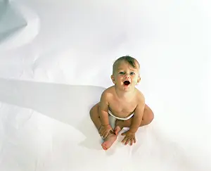 Nappy Prints: High angle view of a baby sitting and looking up
