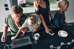 Elementaryage Prints: High angle view of family using technologies at dining table in room