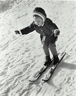 Balance Prints: High angle view of a girl skiing on snow