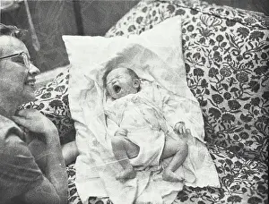 Beginnings Prints: High angle view of a newborn baby girl yawning