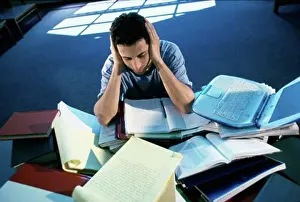 Mixed Prints: High angle view of a teenage boy studying